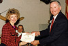 Eileen Duncan receiving her membership certificate
